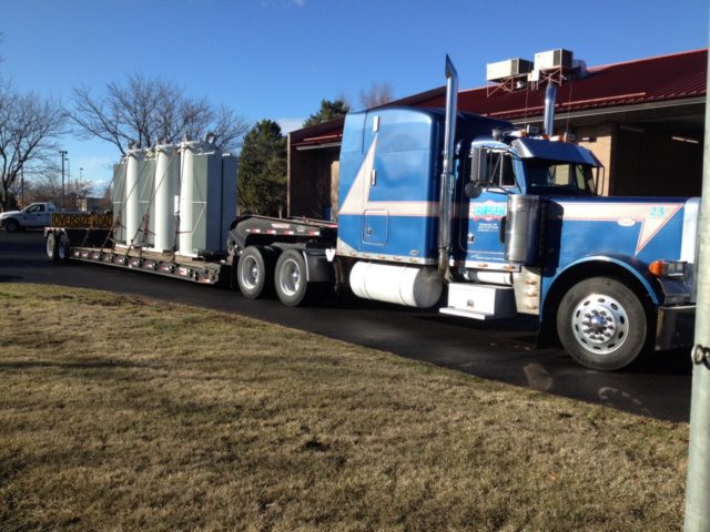flatbed with load by every trucking